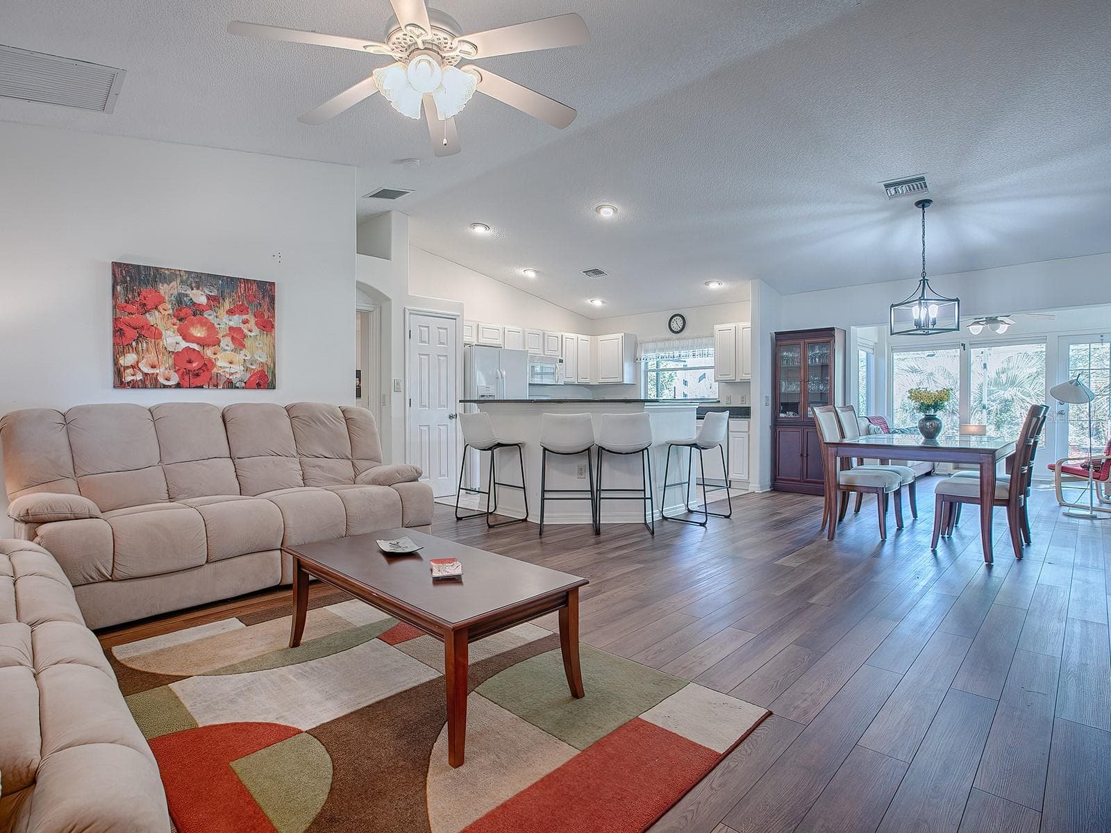 BEFORE FURNITURE WAS REMOVED - ANOTHER VIEW OF MAIN LIVING/DINING AREA - 33236 GRAND CYPRESS WAY, LEESBURG