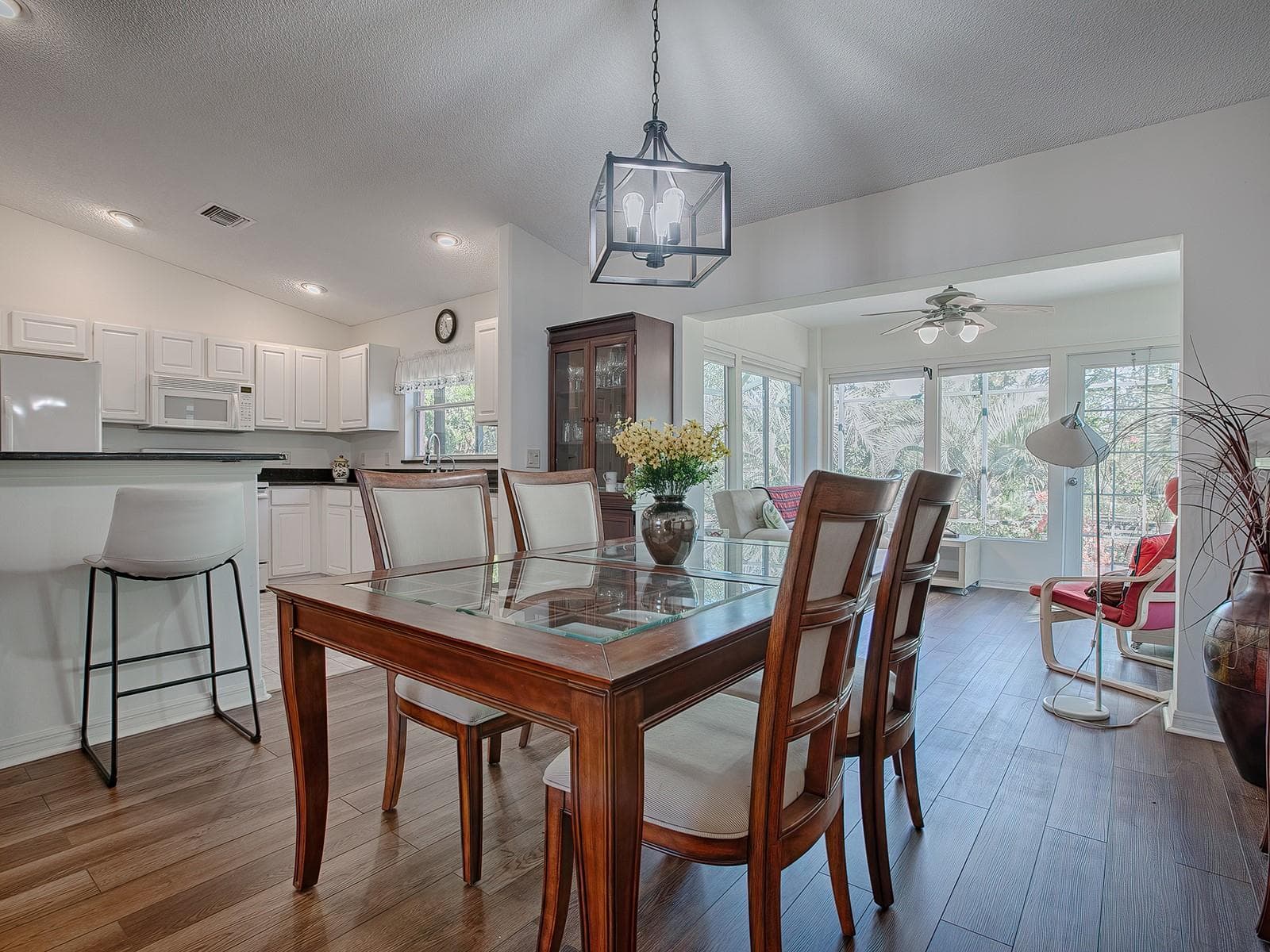 BEFORE FURNITURE WAS REMOVED - DINING AREA TO SUNROOM - 33236 GRAND CYPRESS WAY, LEESBURG