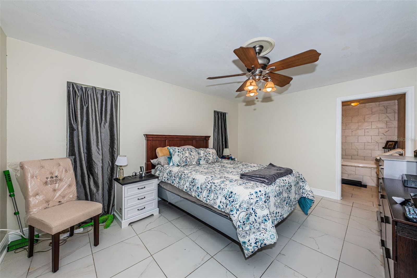 Primary bedroom with large bathroom and walk in closet - 5230 VENETIAN BLVD NE, ST PETERSBURG