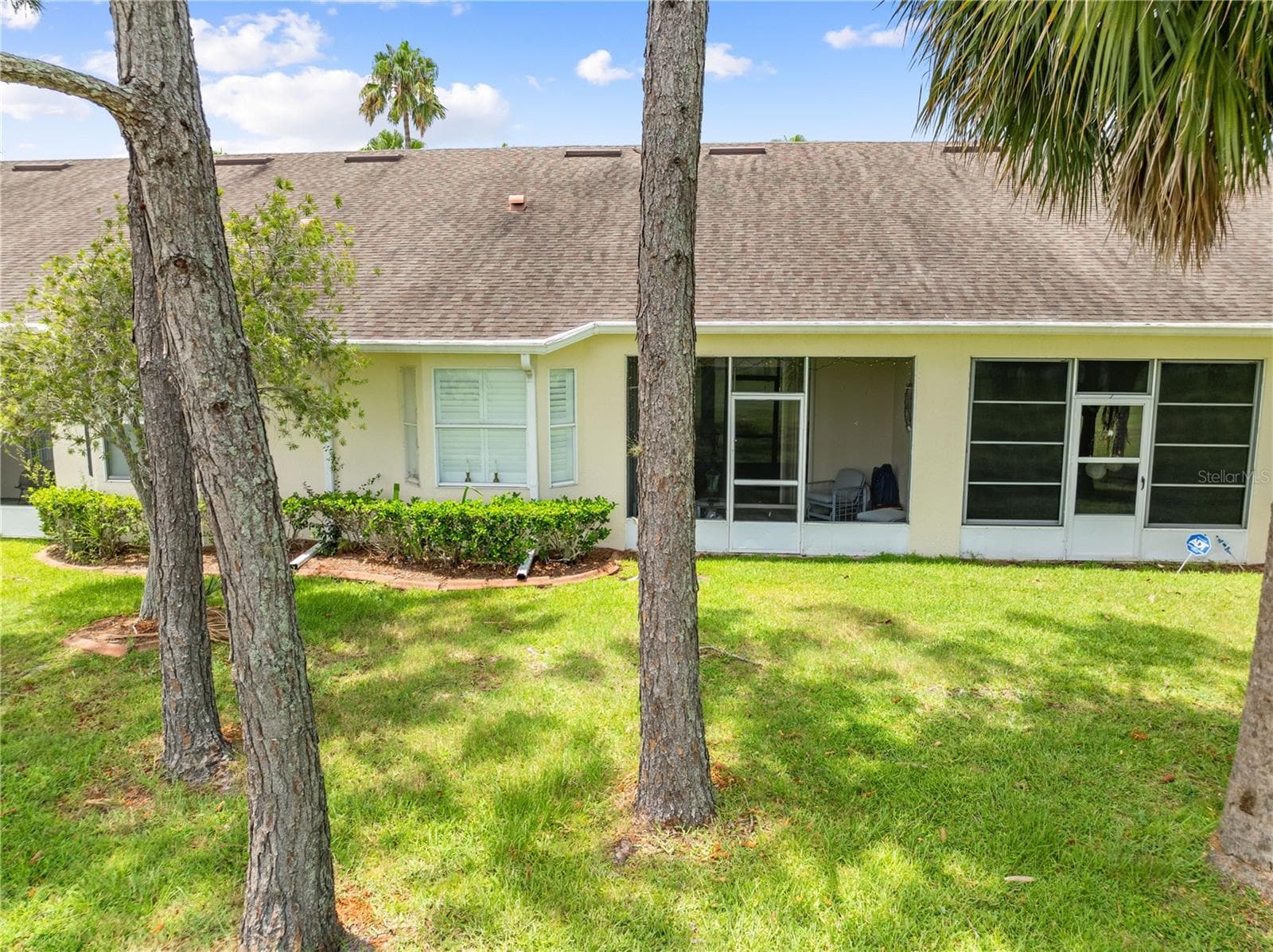 Exterior view of 153 Club Villas - screened back lanai overlooking the golf course. - 153 CLUB VILLAS LN, KISSIMMEE