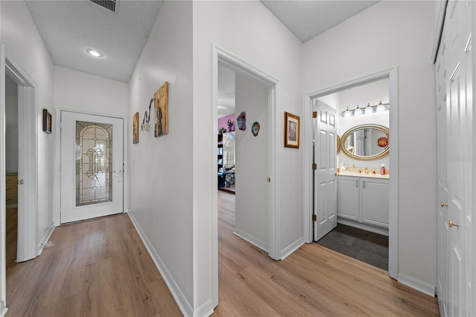 Interior view of the front entrance door and bedroom & bathroom 2. - 153 CLUB VILLAS LN, KISSIMMEE
