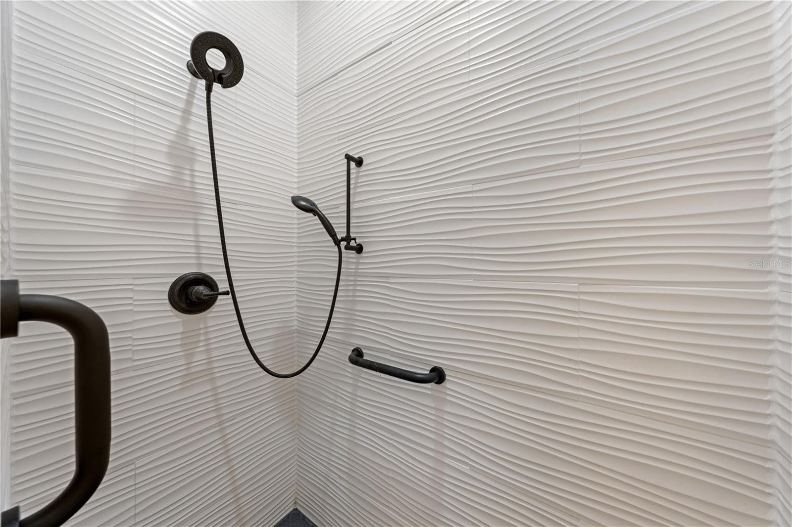 Primary bathroom with lots of updates and custom tile. - 153 CLUB VILLAS LN, KISSIMMEE