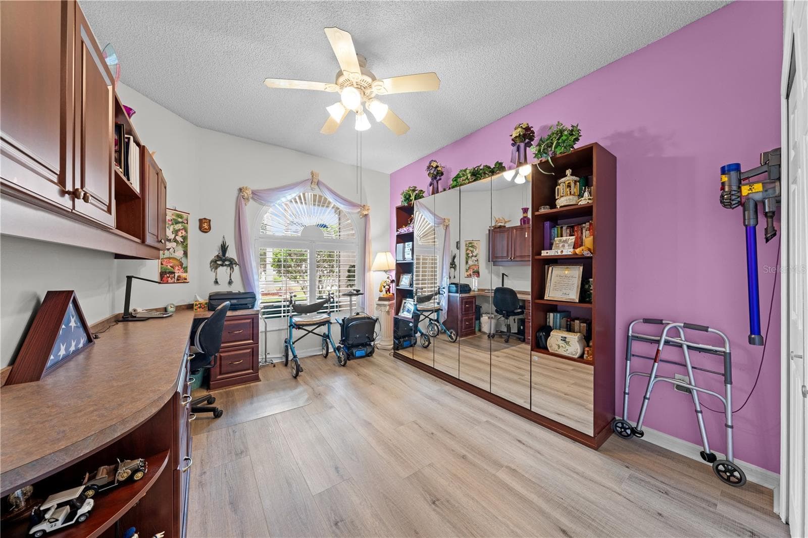 Bedroom 2 with built in cabinets and a murphy bed for smart spaces. - 153 CLUB VILLAS LN, KISSIMMEE