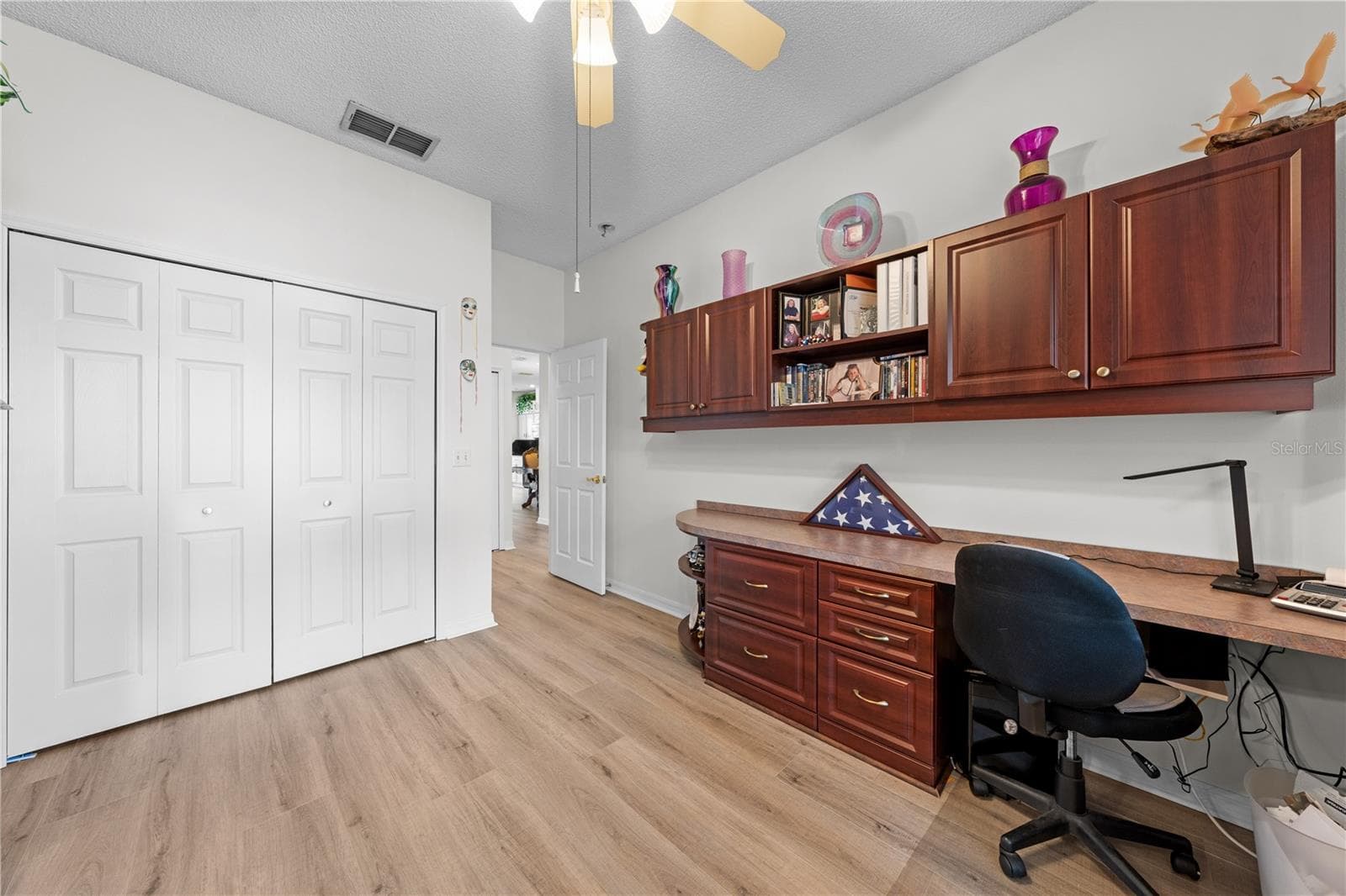 Bedroom 2 that has a murphy bed and built in cabinets and desk. - 153 CLUB VILLAS LN, KISSIMMEE