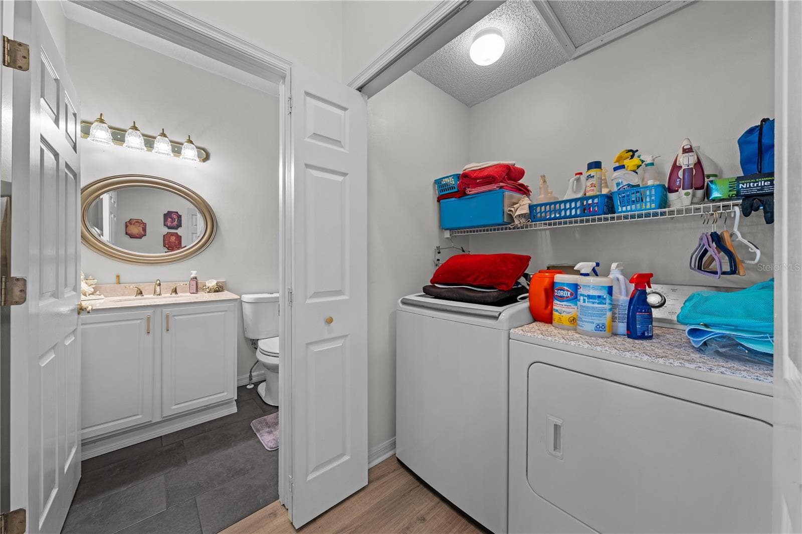 Interior laundry conveniently located next to bathroom 2 - 153 CLUB VILLAS LN, KISSIMMEE