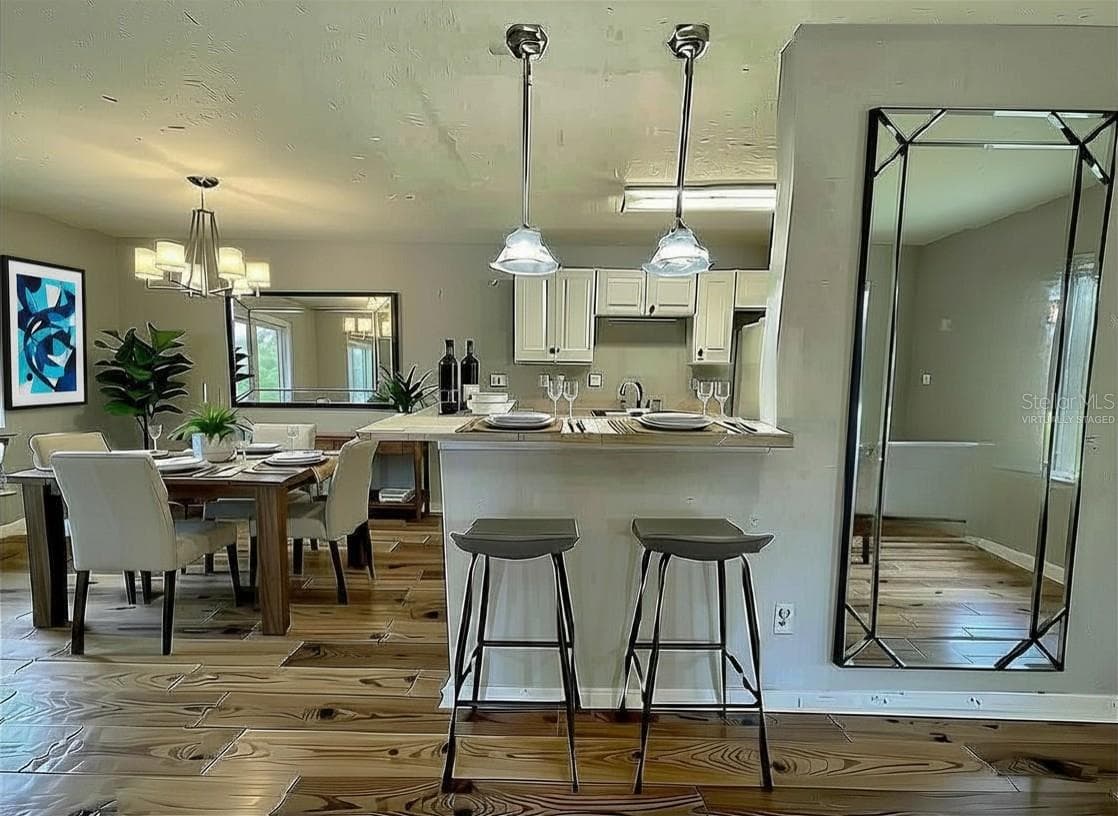 virtually staged.. This place would look great with luxury vinyl plank flooring or new carpet. - 145 N PEARL LAKE CSWY #112, ALTAMONTE SPRINGS