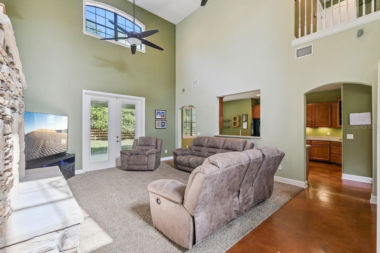 Living Room with French Doors that lead out to the Covered Patio - 36137 MATTAWAN DR, EUSTIS