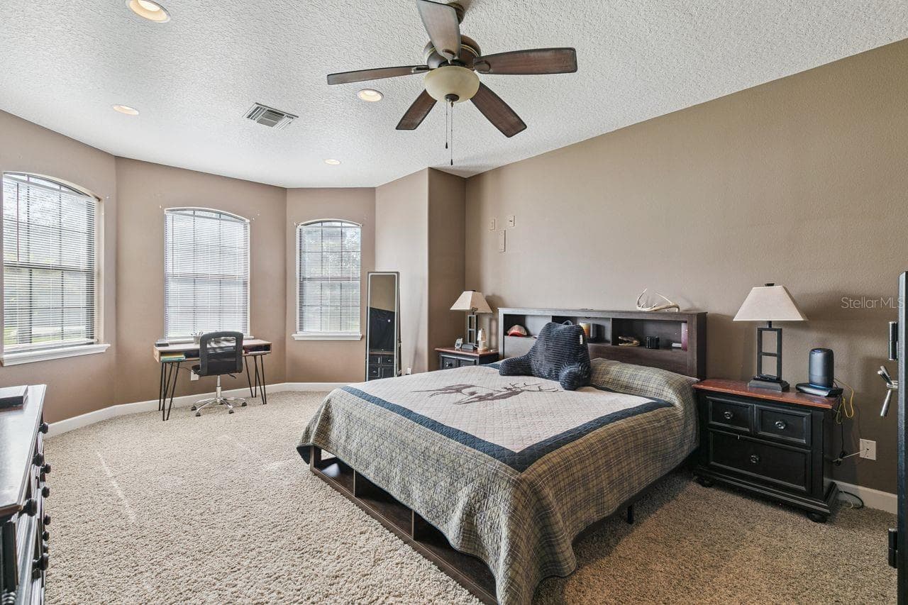 Primary Bedroom on First Floor with Two Walk-In Closets - 36137 MATTAWAN DR, EUSTIS