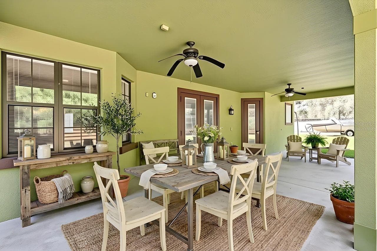 Virtually Staged Covered Patio with view to the Conservtion Area - 36137 MATTAWAN DR, EUSTIS