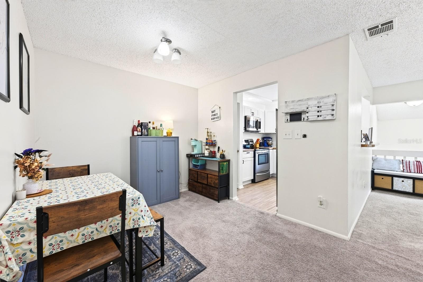 Dining area flows seamlessly into the kitchen from the living area. - 4607 RING NECK RD #36C, ORLANDO