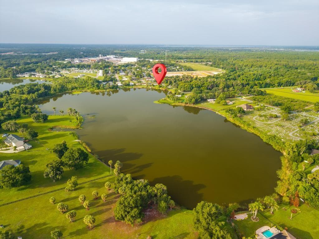 View of Lake Mary from opposite side - 57 CAYMAN CIR, UMATILLA