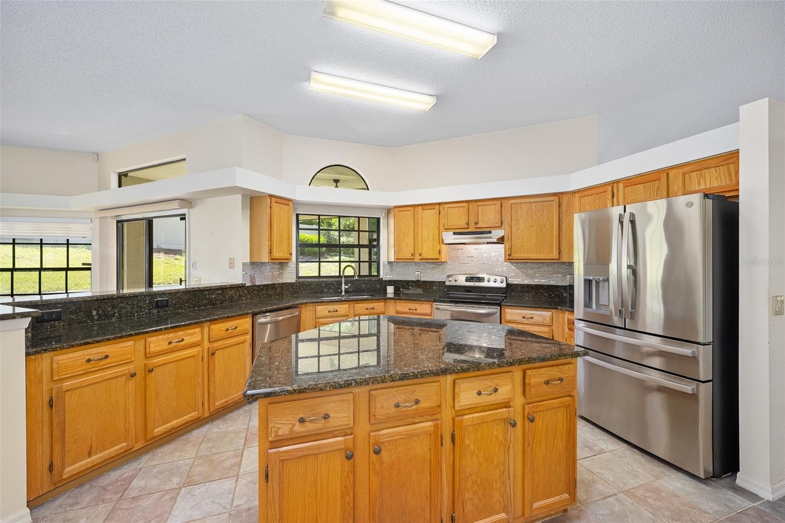 Kitchen with island - 1837 E GLANCY DR, DELTONA