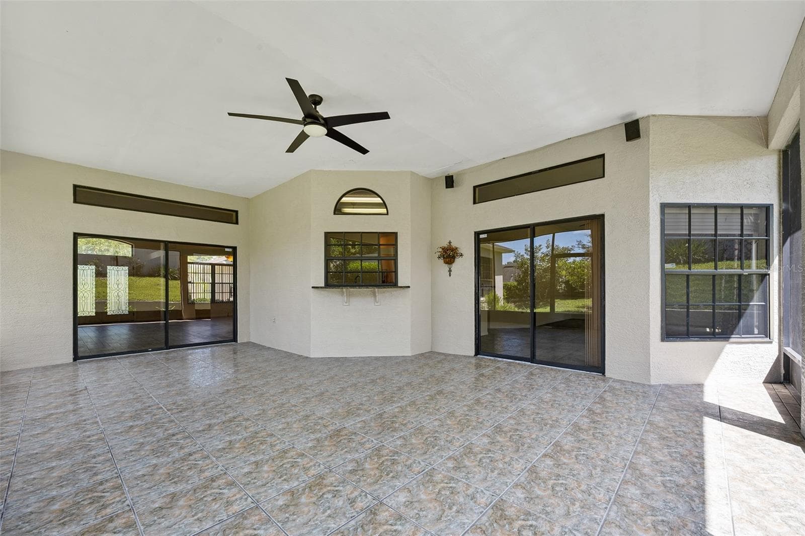 Lovely tile flooring on lanai - 1837 E GLANCY DR, DELTONA