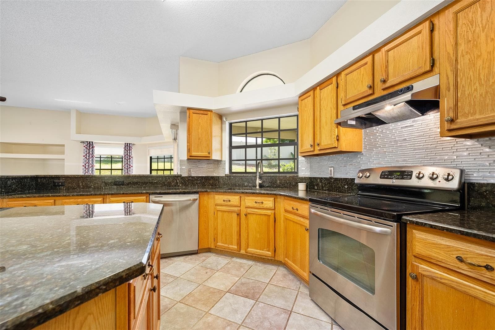 Wood cabinets and stainless appliances - 1837 E GLANCY DR, DELTONA