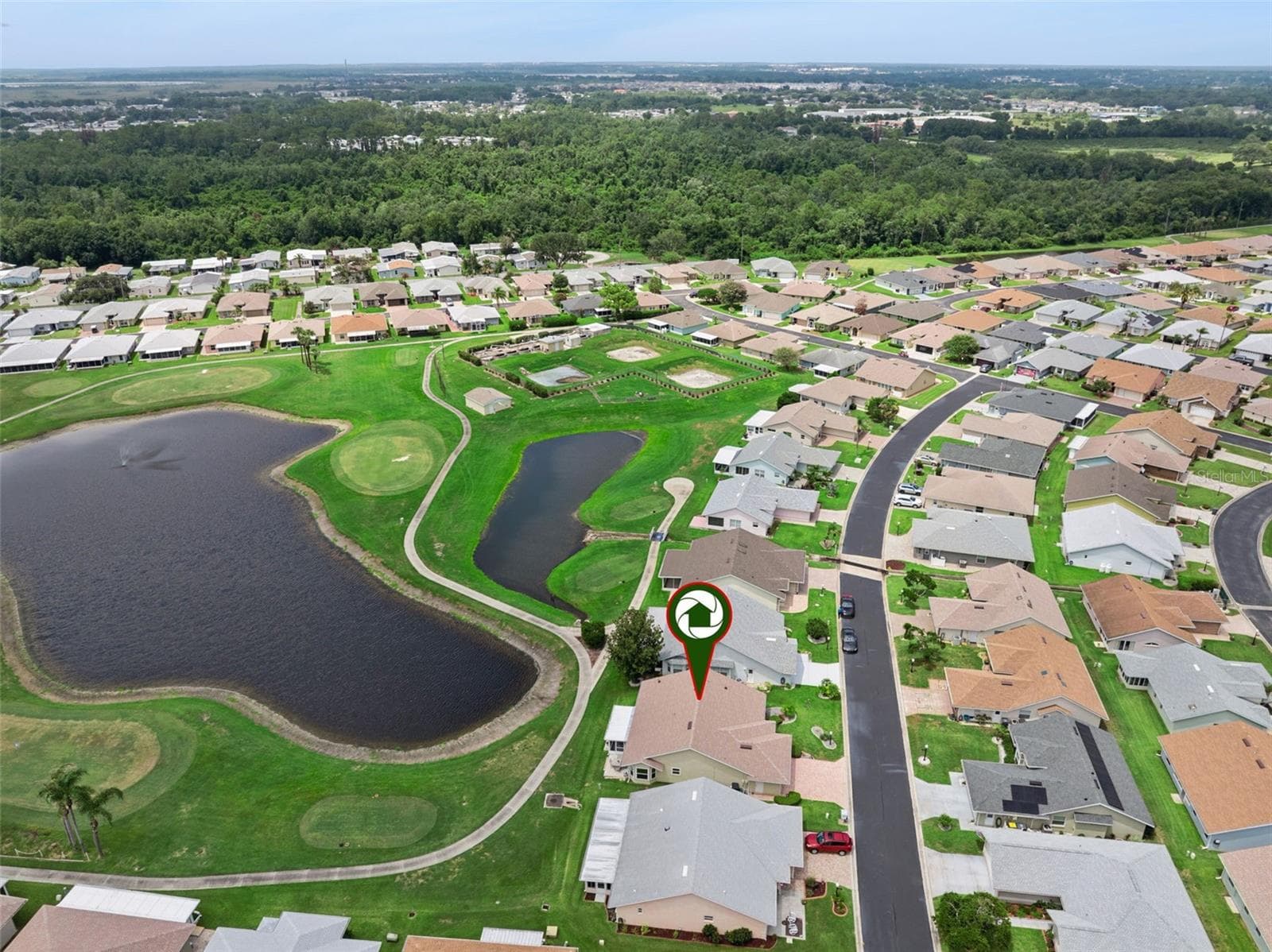 Sited on a premium golf course-front lot with picturesque pond views - 501 EASTLAKE DR, HAINES CITY