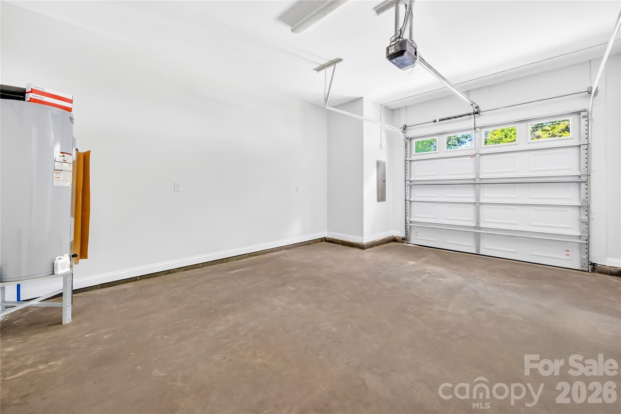 Attached one-car garage with storage space in a new construction Charlotte duet with no HOA - 1940 Purser Drive, Charlotte