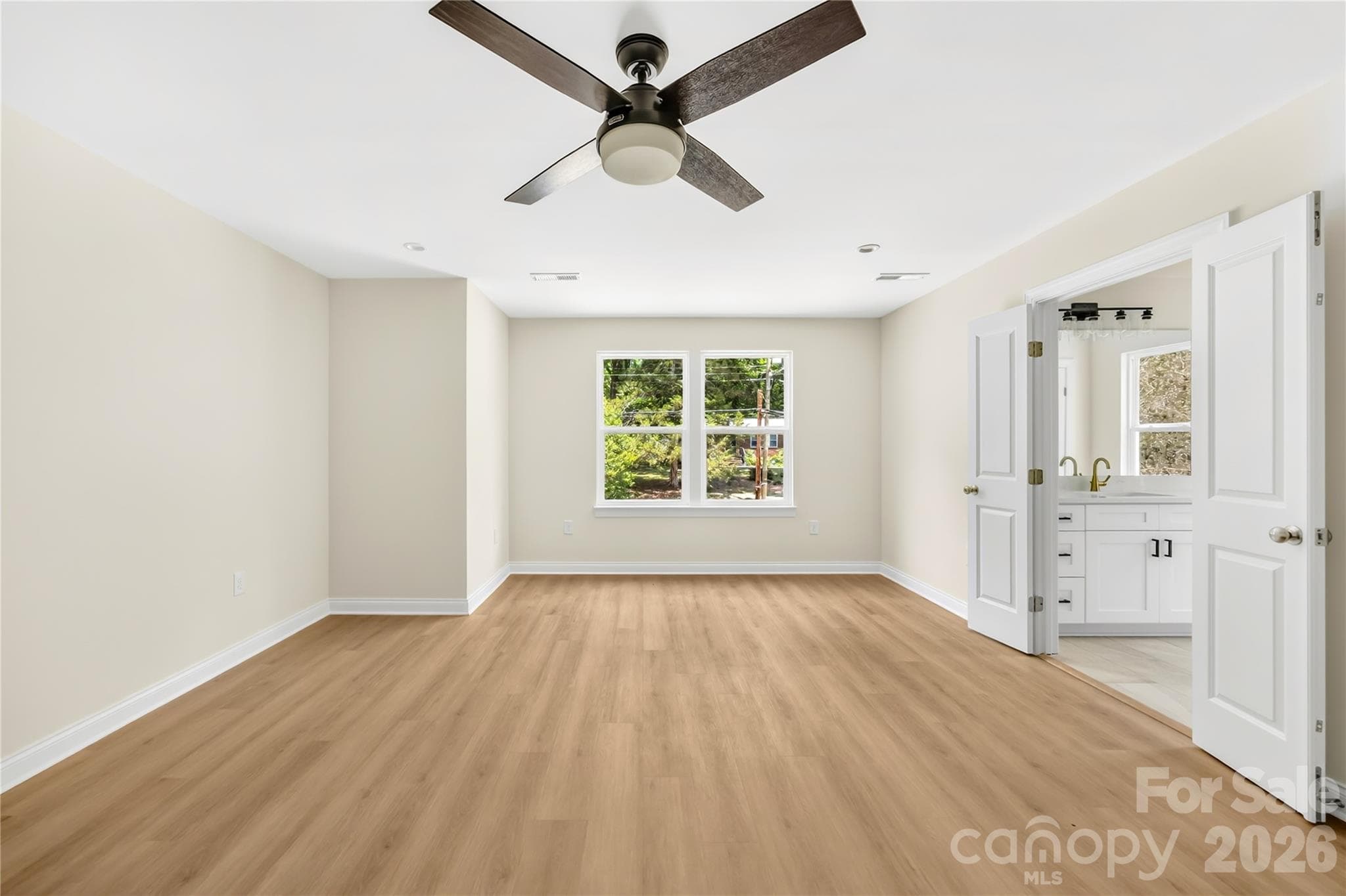 Primary bedroom with private bathroom at 1940 Purser Dr, new construction in Charlotte, NC 28215 - 1940 Purser Drive, Charlotte