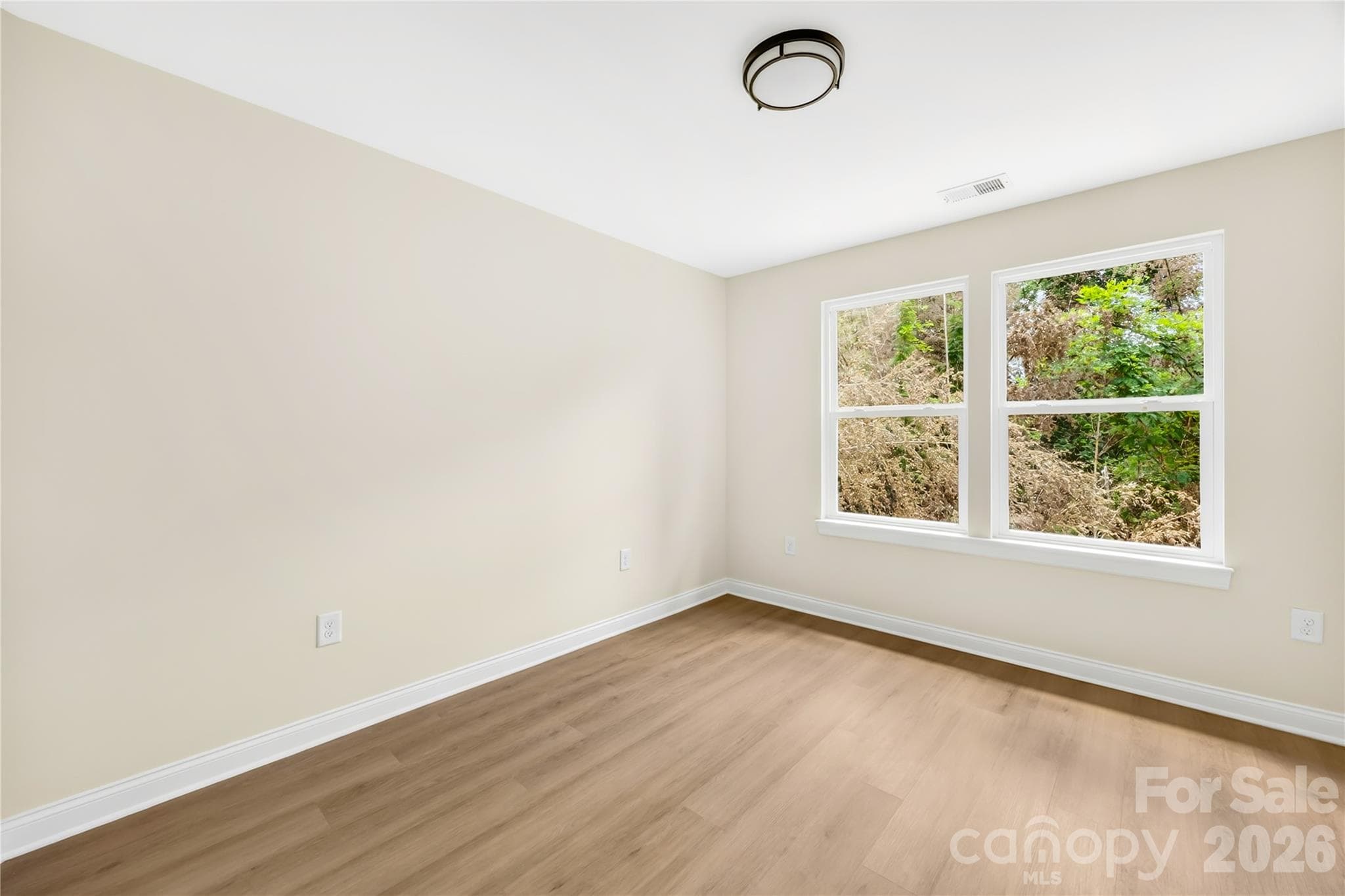Third bedroom upstairs with natural light in a new construction duet near NoDa, Charlotte - 1940 Purser Drive, Charlotte