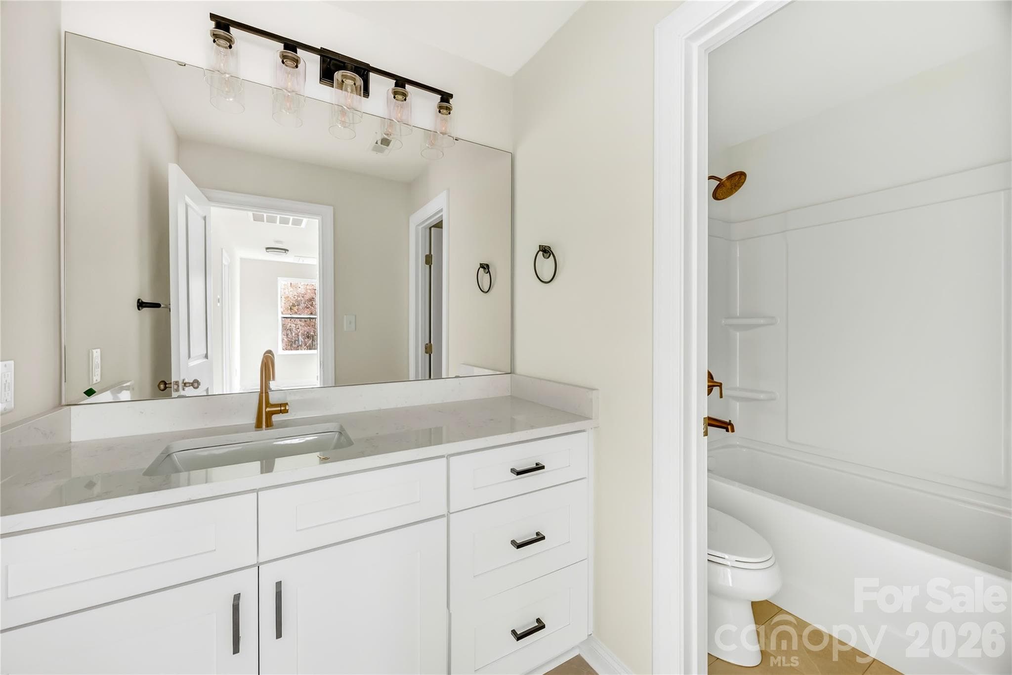 Upstairs full bathroom with tub and storage at 1940 Purser Dr, Charlotte, NC - 1940 Purser Drive, Charlotte