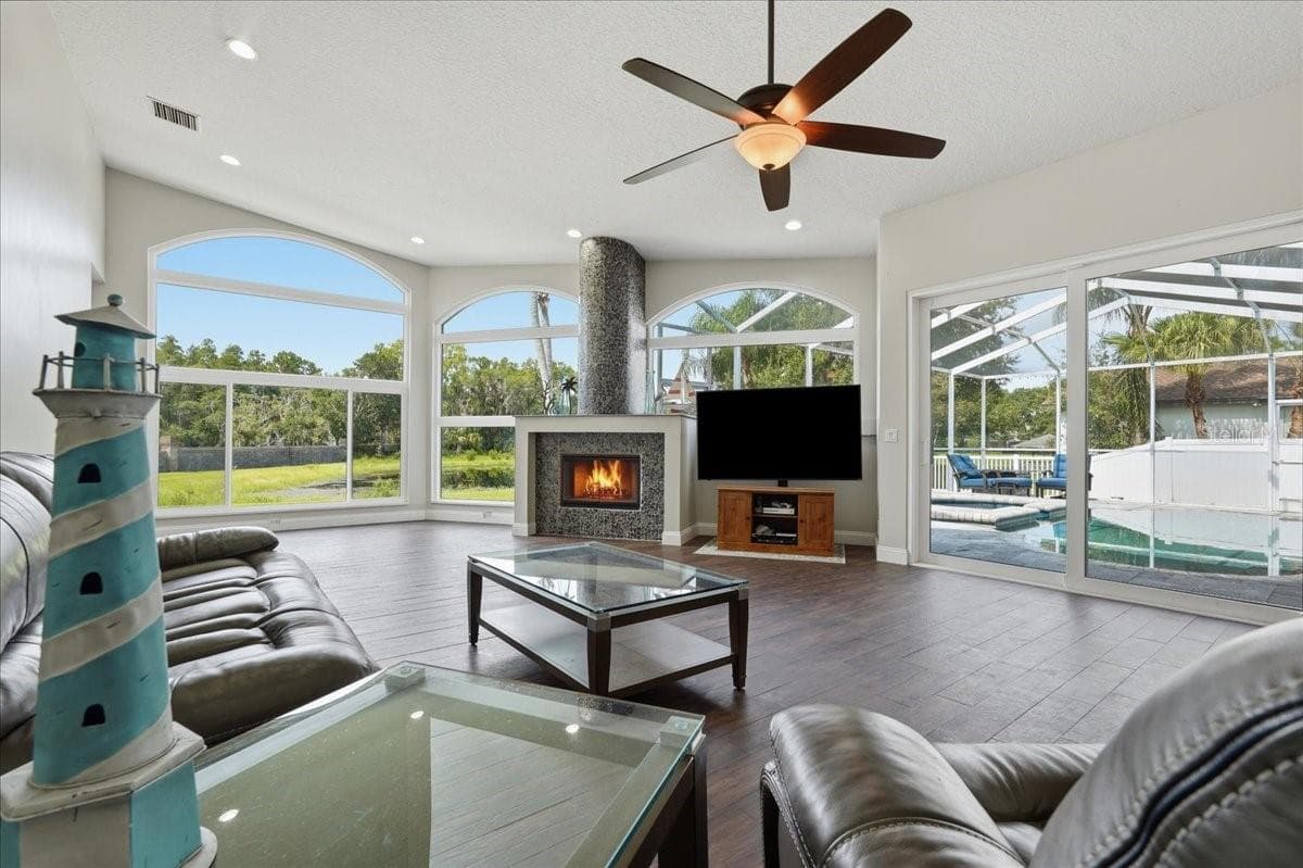 Expansive views of the spring fed pond and pool from the Great Room - 17024 WINNERS CIR, ODESSA