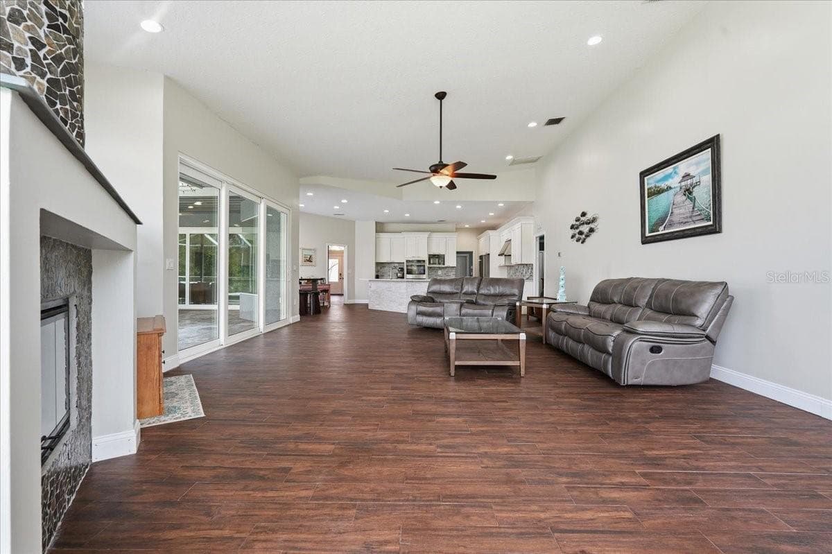 Great room with wood burning fireplace - 17024 WINNERS CIR, ODESSA