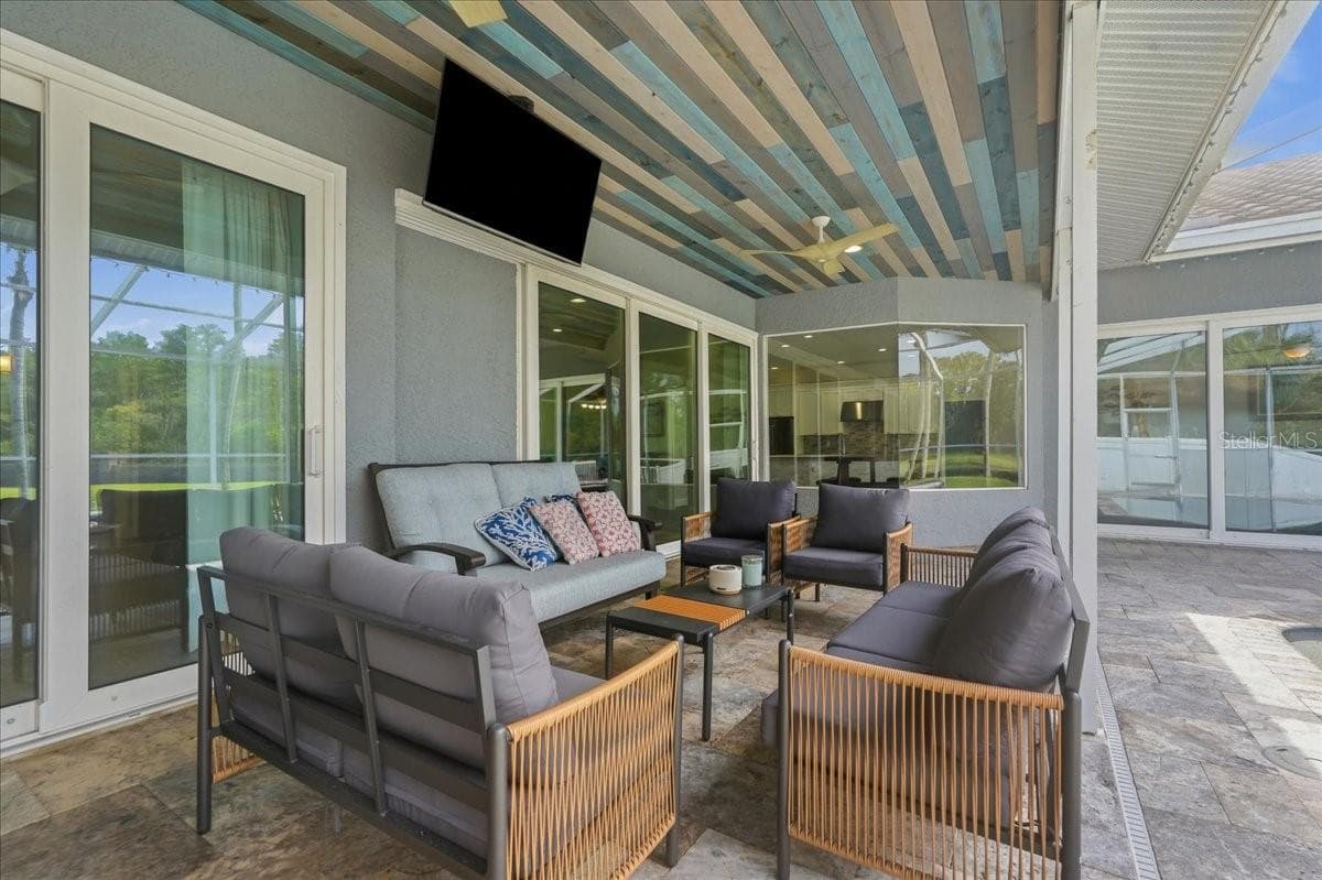 Covered poolside patio area perfect for gatherings - 17024 WINNERS CIR, ODESSA