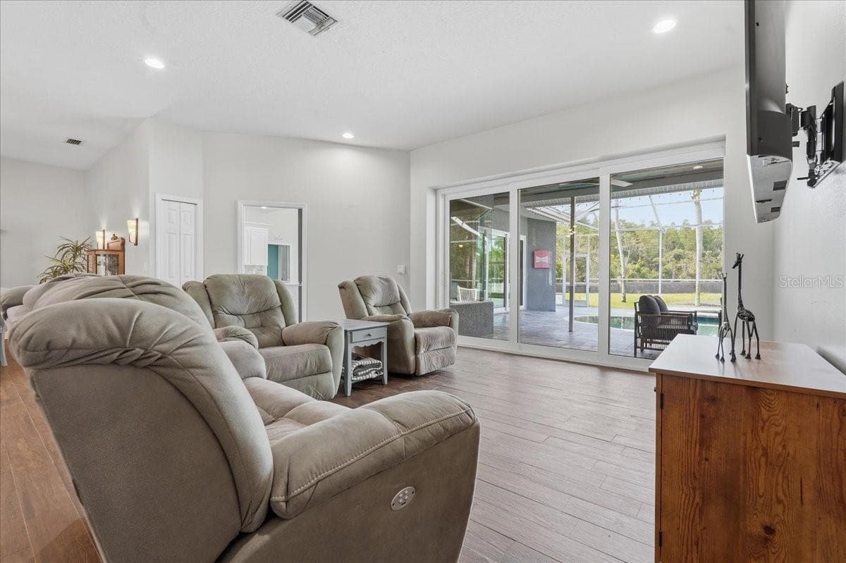 Living Room with triple double pane recessed sliding doors - 17024 WINNERS CIR, ODESSA