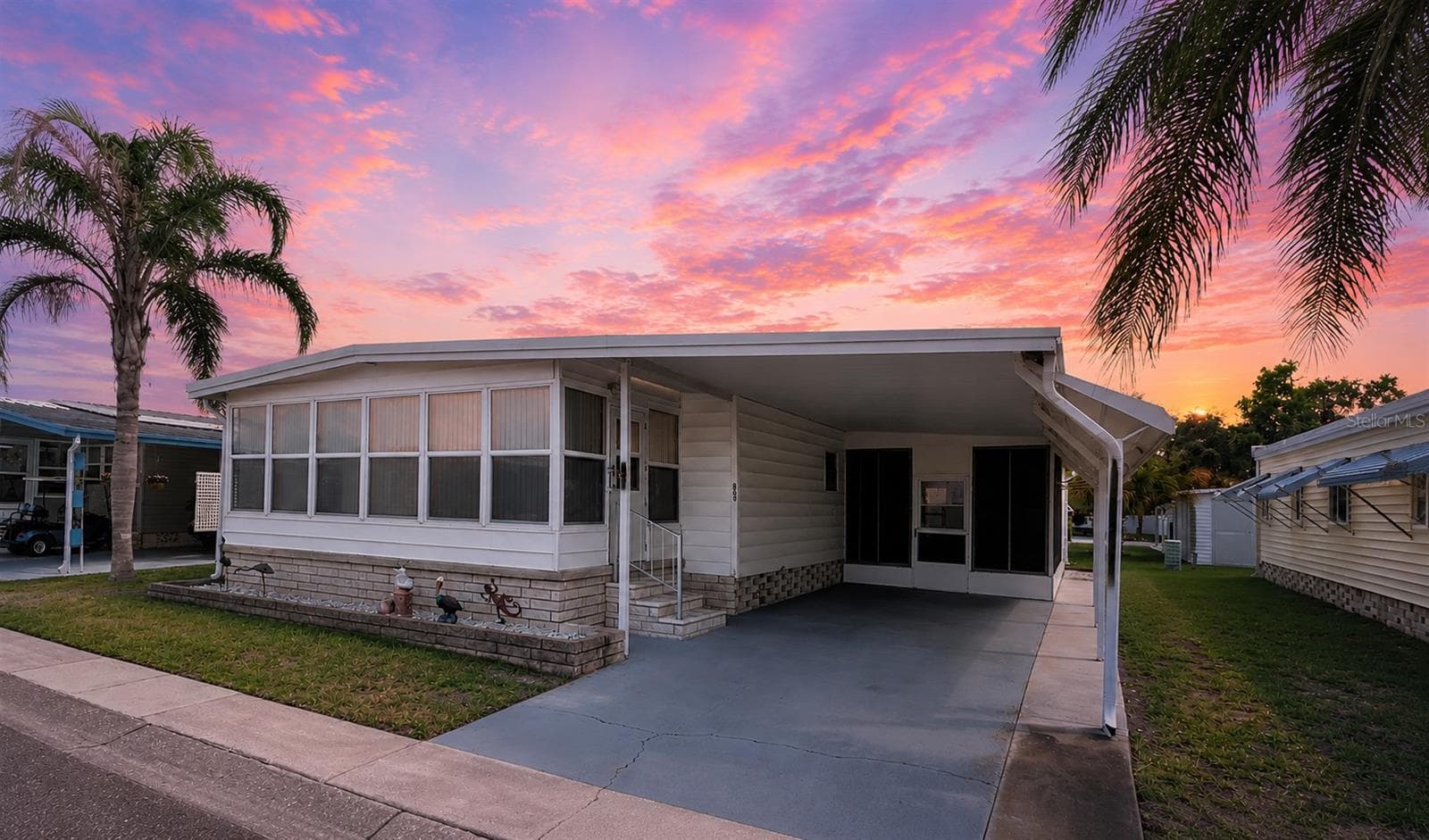 Sunset view of home - 1100 BELCHER RD S #663, LARGO