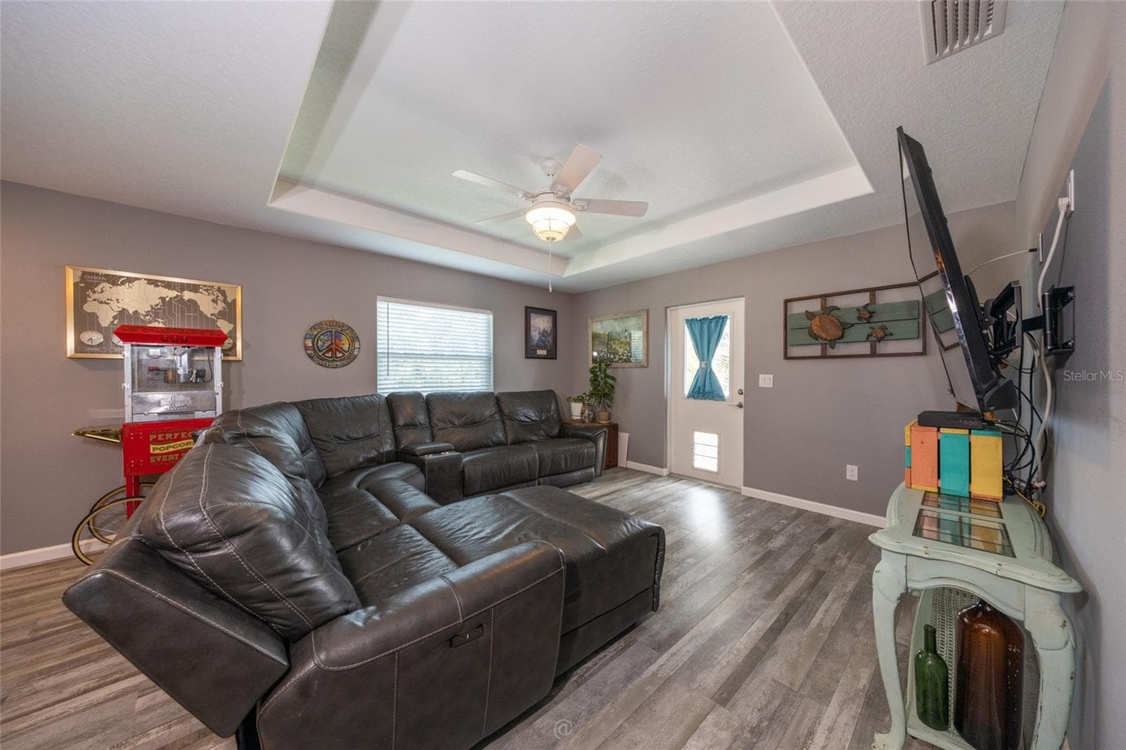Tray ceiling in the spacious family room. Door leads to front deck - 904 S DAYTONA AVE, FLAGLER BEACH