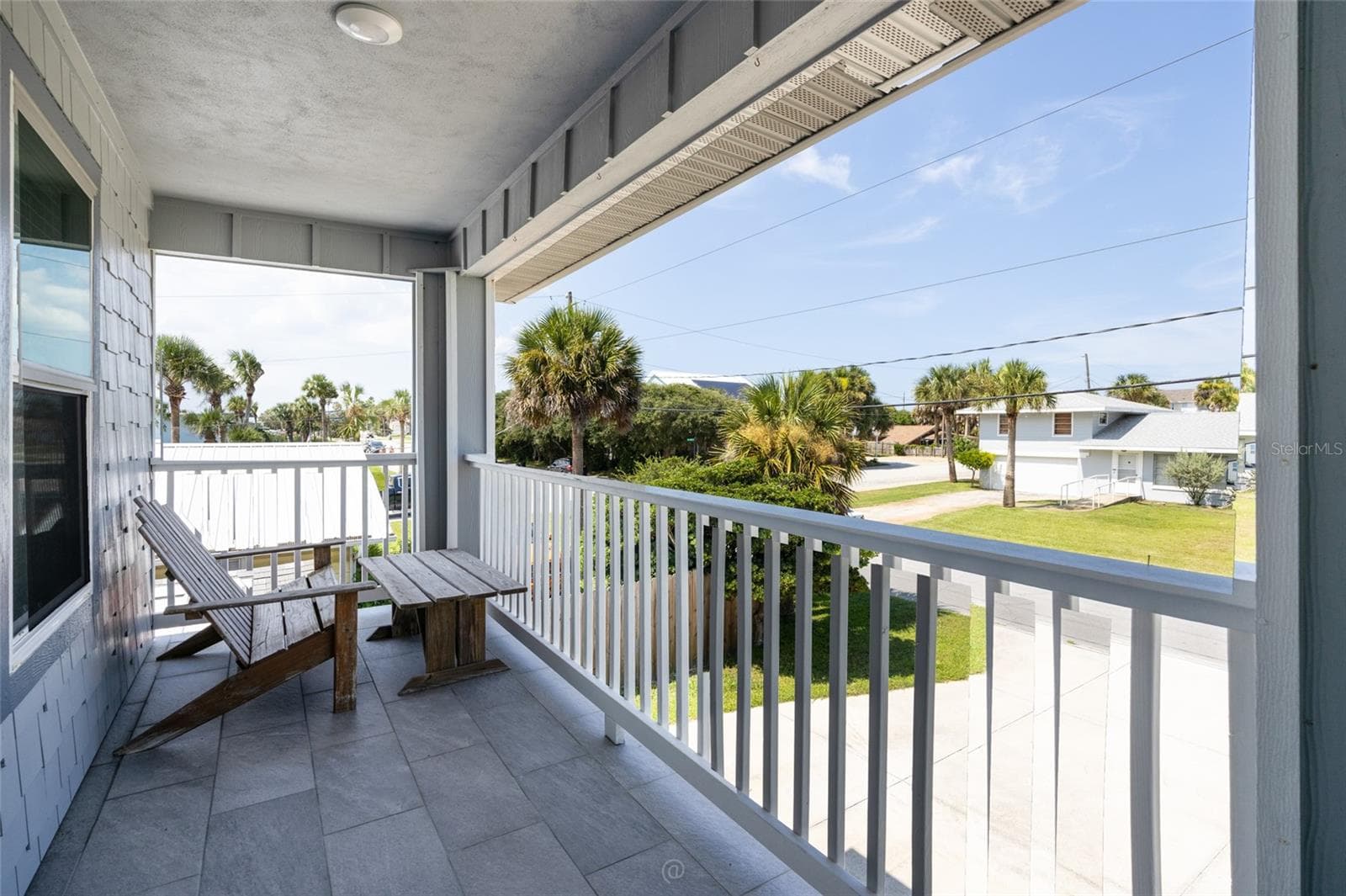 Spacious tiled front porch/deck, facing East - 904 S DAYTONA AVE, FLAGLER BEACH