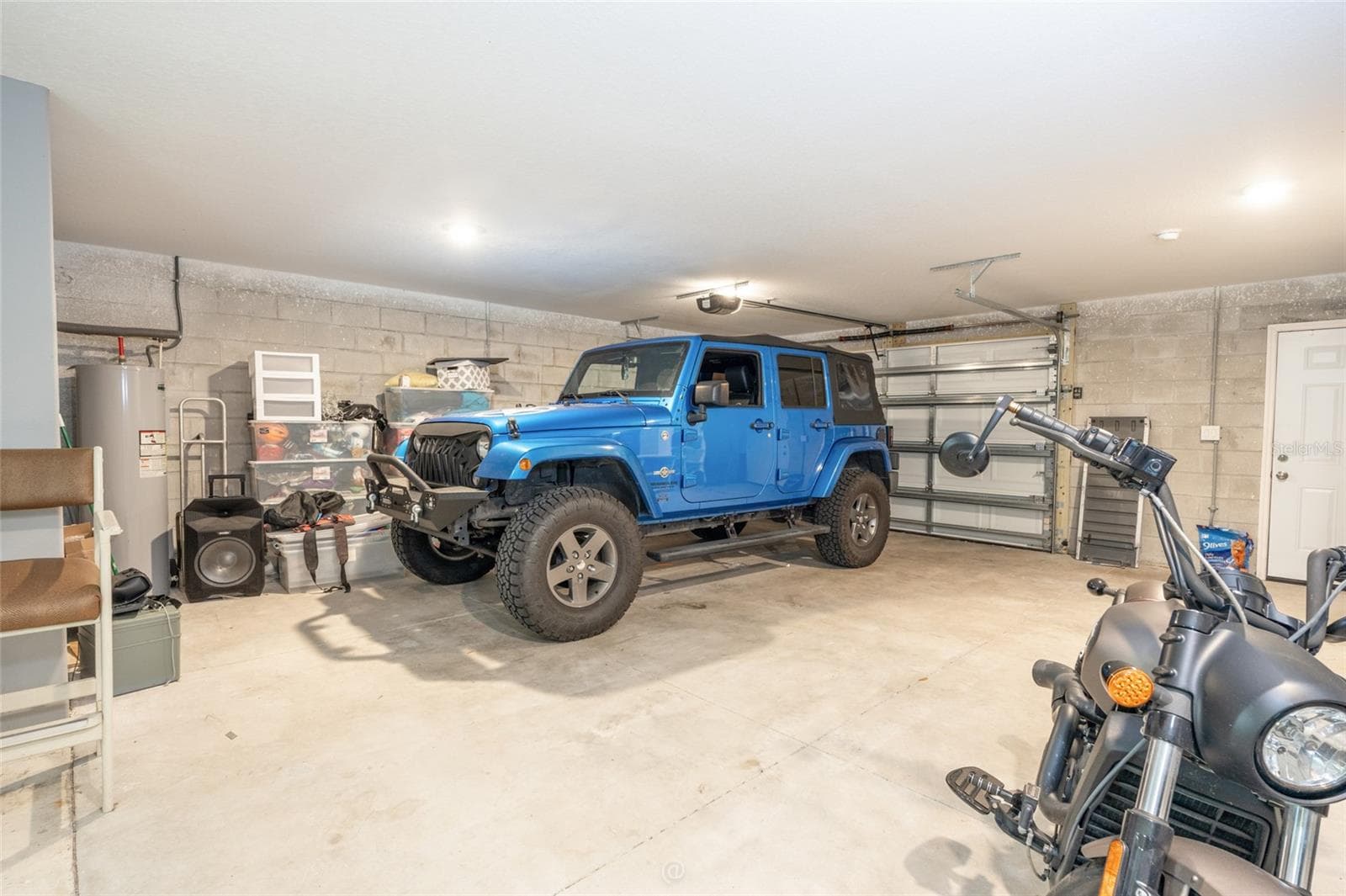View of parking in the garage. Split AC system - 904 S DAYTONA AVE, FLAGLER BEACH