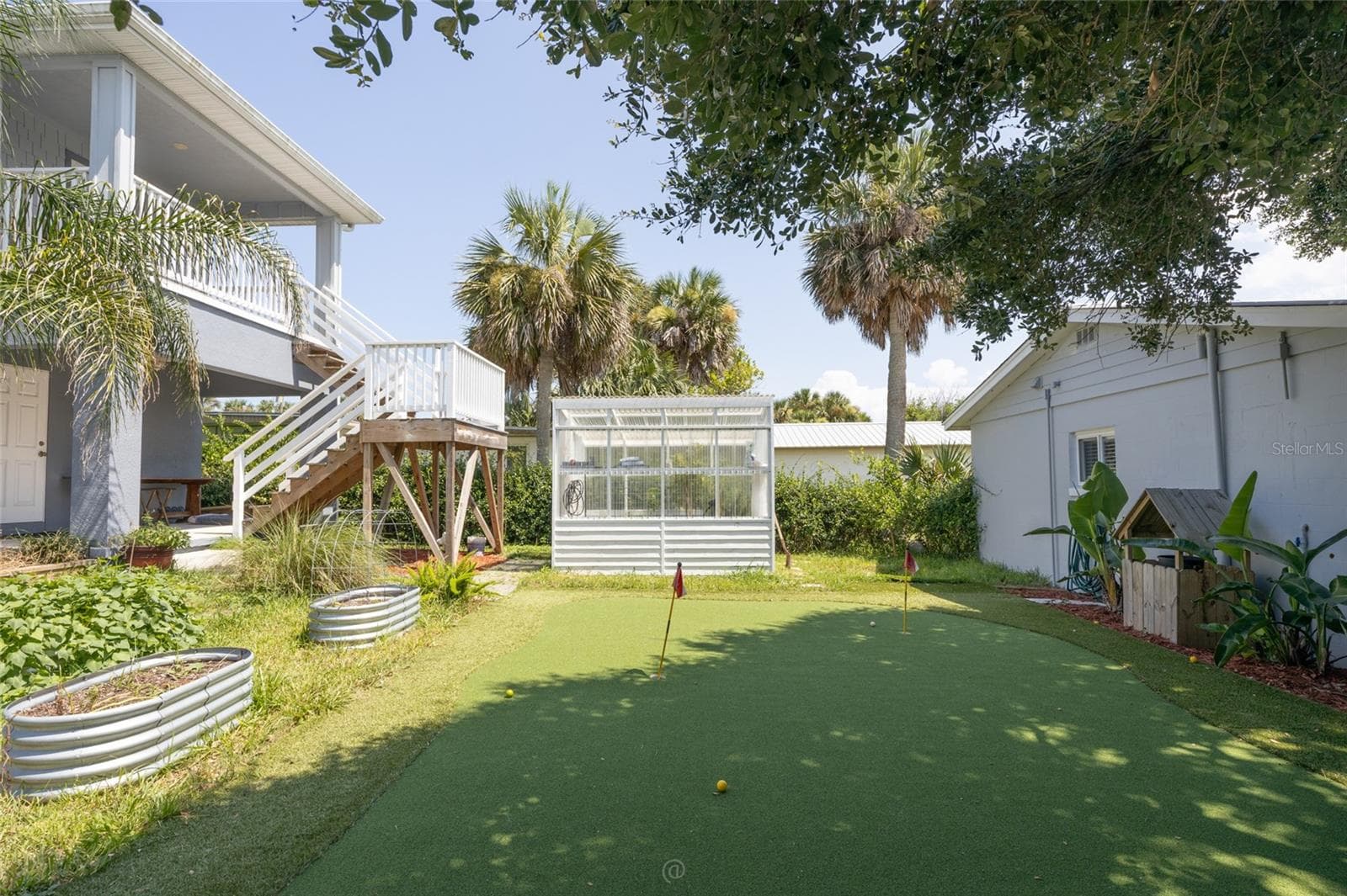 View of house, greenhouse & apartment in-law suite - 904 S DAYTONA AVE, FLAGLER BEACH