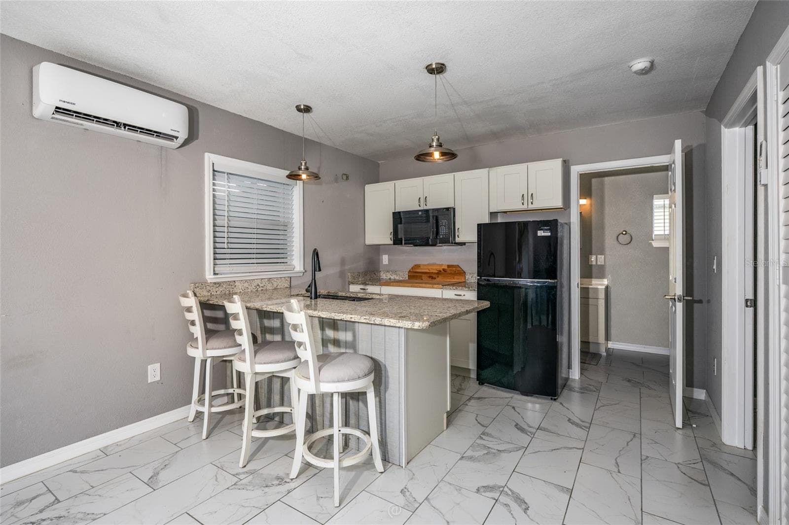 Family room & view of kitchenette in apartment in-law suite - 904 S DAYTONA AVE, FLAGLER BEACH