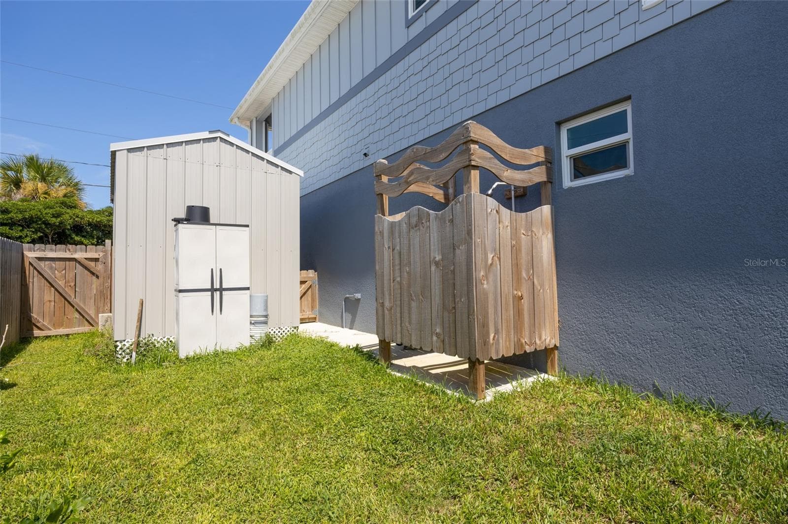 View of shed or golf cart garage. Exterior shower - 904 S DAYTONA AVE, FLAGLER BEACH