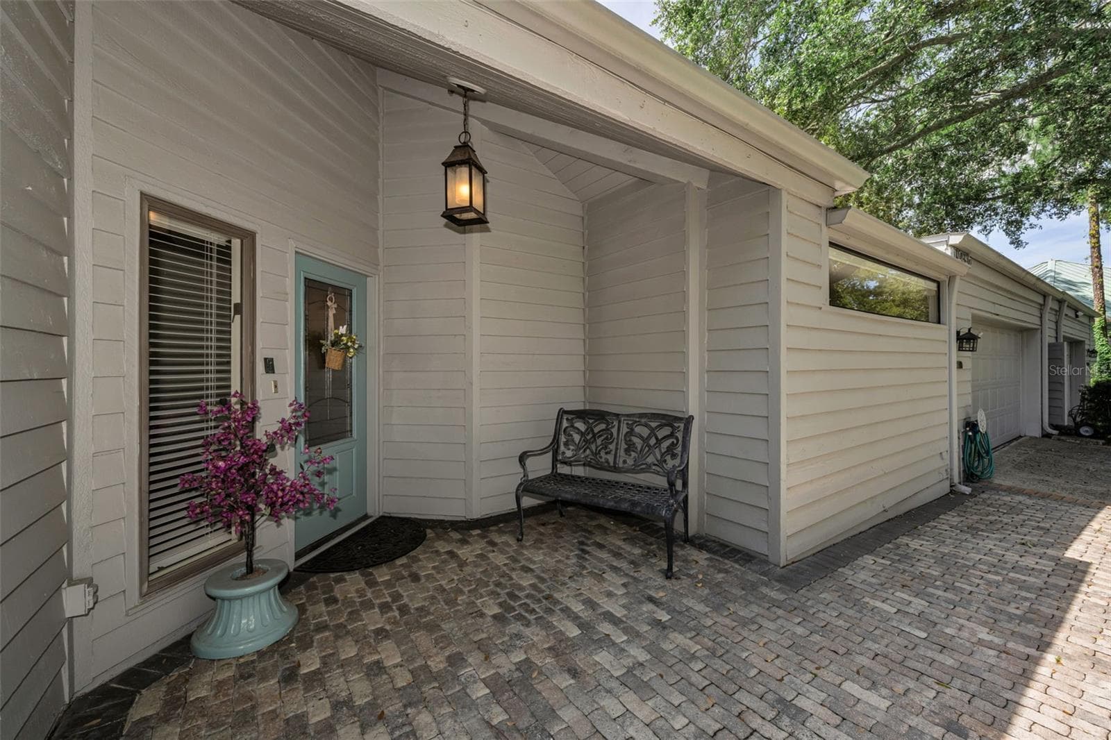 Beautiful pavers surround the charming front door of the 3/2/2 home! - 10497 LONGWOOD DR, SEMINOLE