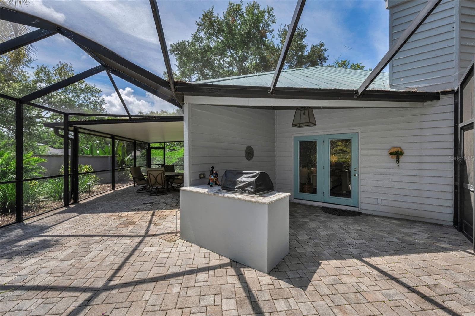 Grill area, outside the living room. - 10497 LONGWOOD DR, SEMINOLE