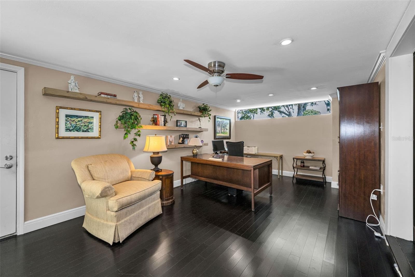 Den with garage door to the left, and formal dining to the right. See floorplan. Such a great flow! - 10497 LONGWOOD DR, SEMINOLE
