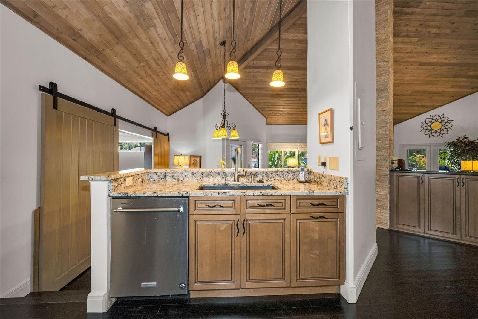 Honey colored cabinets, granite counters and so much storage! Room for all to gather and enjoy!The kitchen overlooks the formal dining area and the spacious living room with the gas fireplace. - 10497 LONGWOOD DR, SEMINOLE