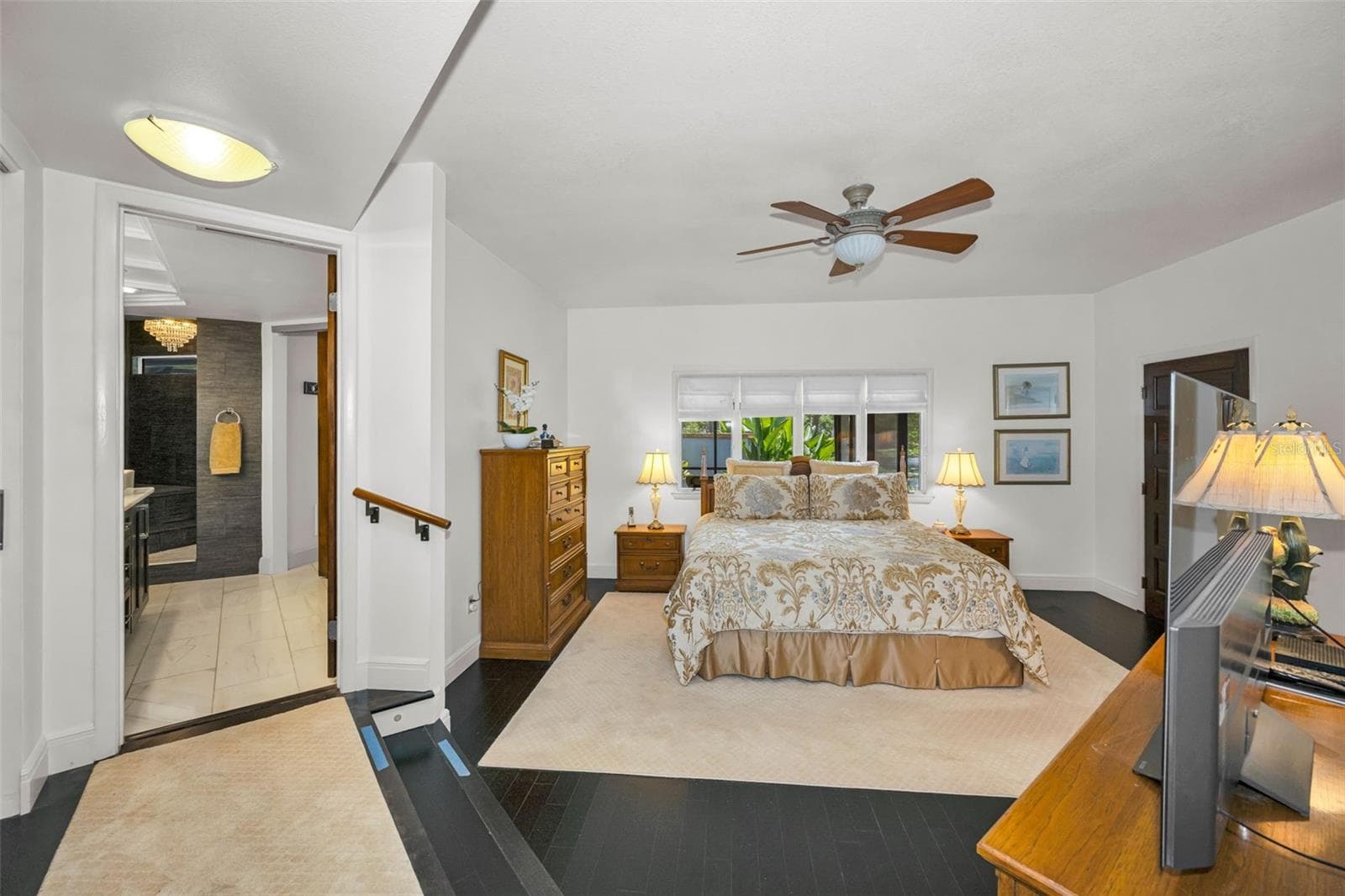 Master bedroom and ensuite bath with walk in shower, walk in closet and sitting area...With a pond view! - 10497 LONGWOOD DR, SEMINOLE