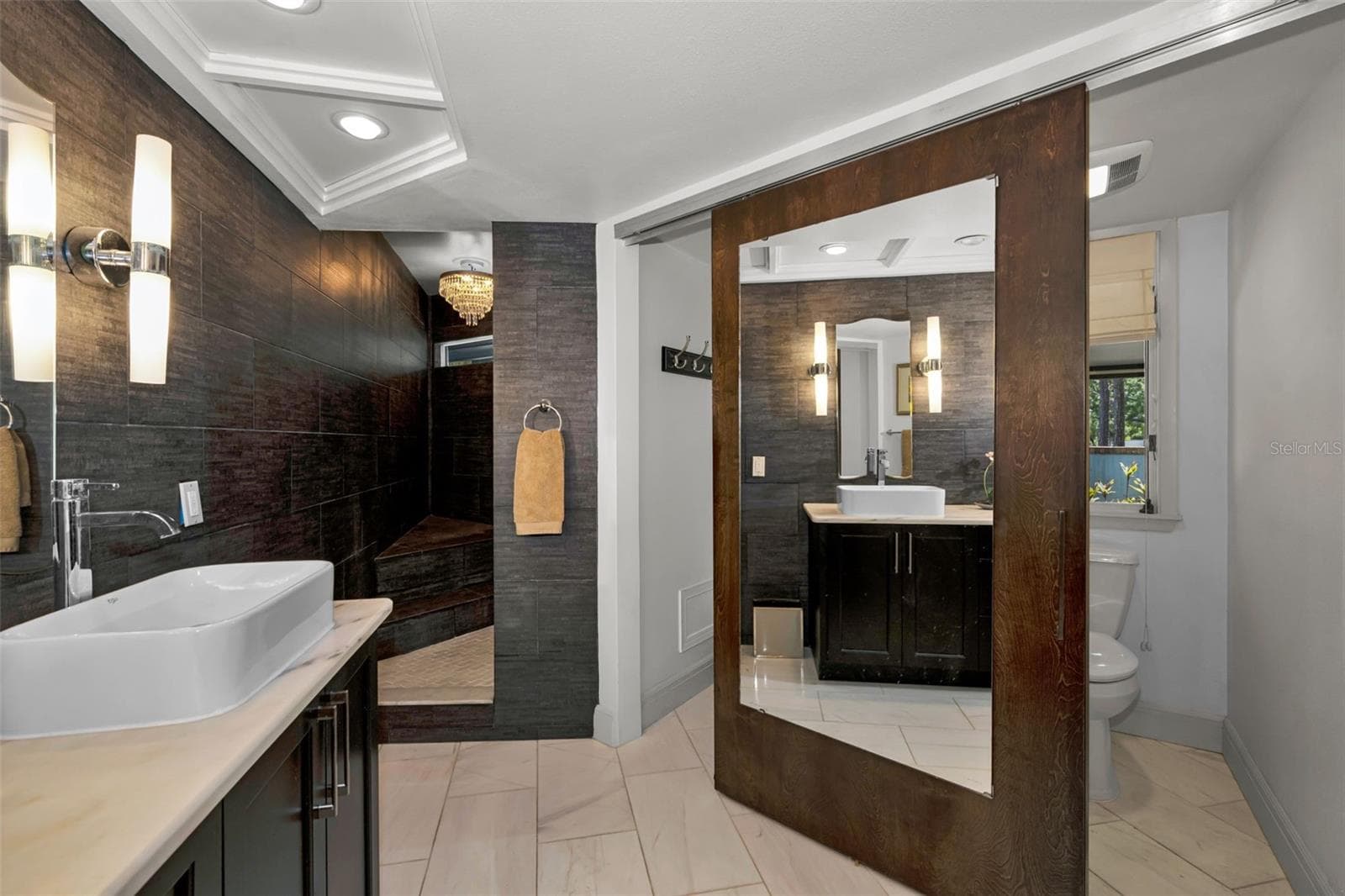 Master bath with linen closet storage and private toilet area. So well designed! - 10497 LONGWOOD DR, SEMINOLE
