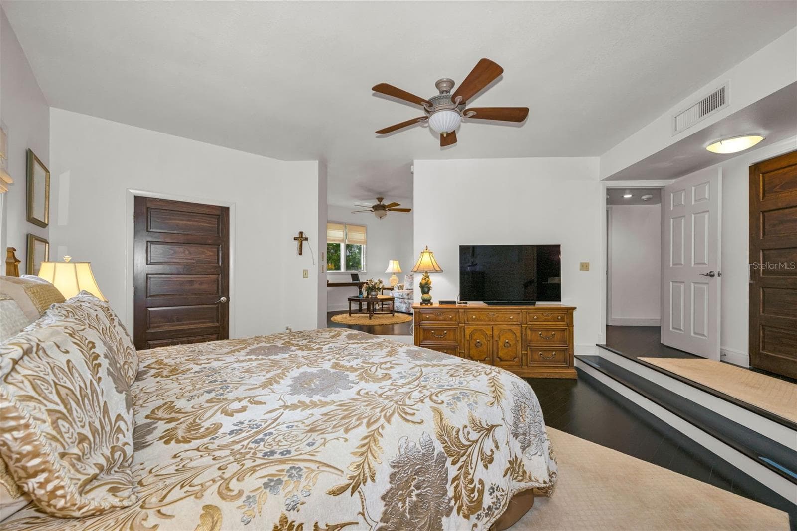 Master bedroom entrance showing the walk in closet to the left and the additional 10' closet to your right. In the distance is the private sitting room which can be a third bedroom again or den/office. - 10497 LONGWOOD DR, SEMINOLE