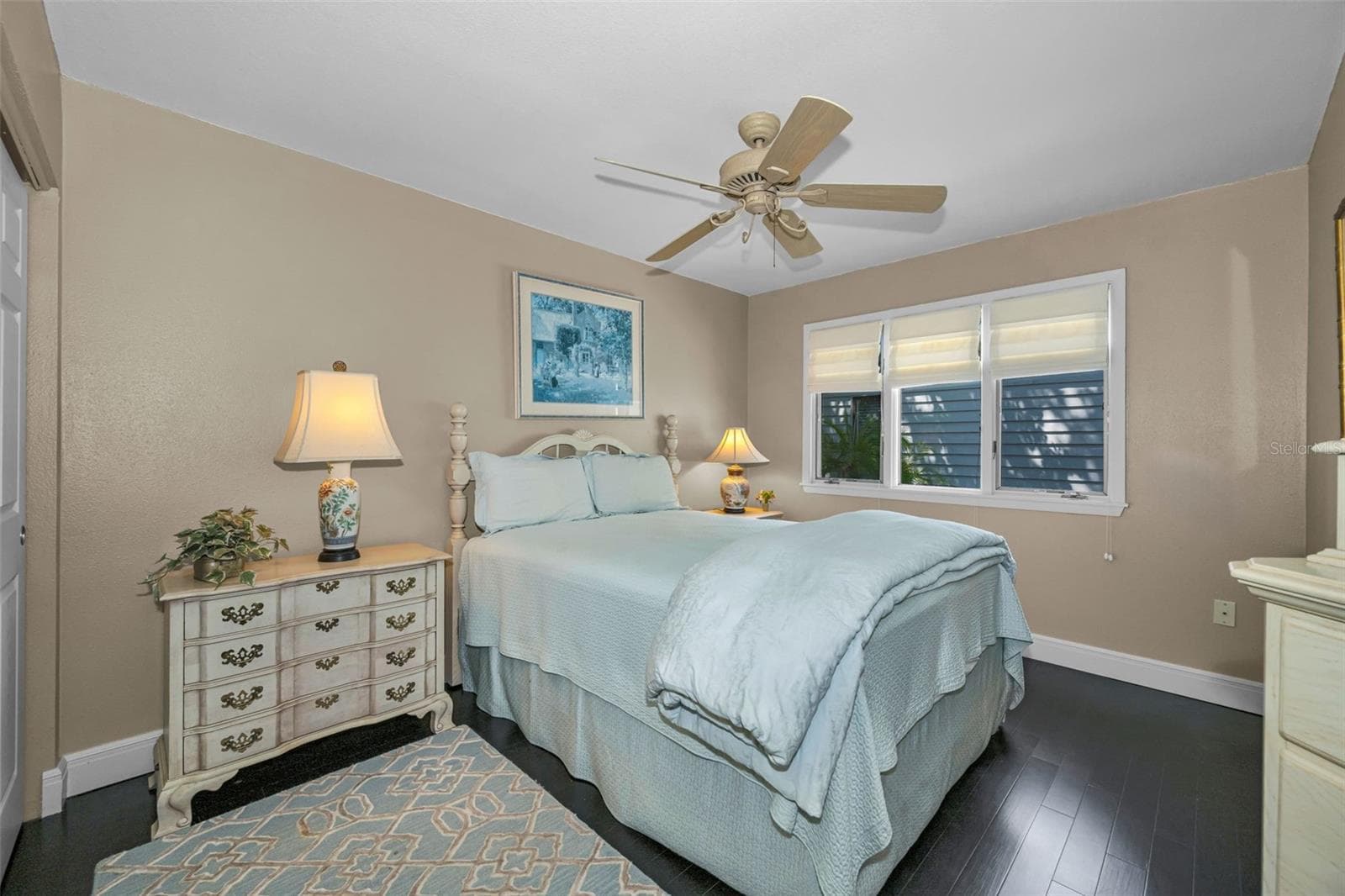 Charming guest bedroom with lots of natural light and a full sized closet. - 10497 LONGWOOD DR, SEMINOLE