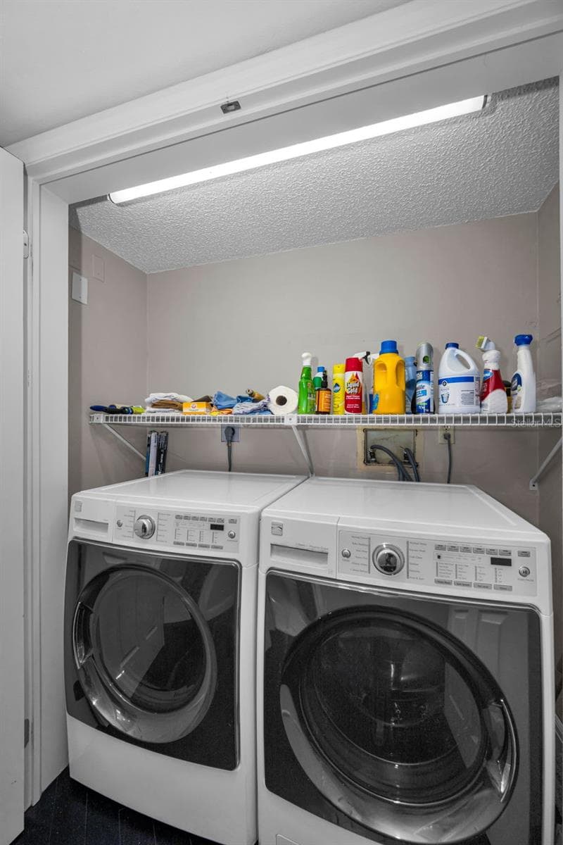 Laundry closet in the back hallway near the bedrooms. - 10497 LONGWOOD DR, SEMINOLE