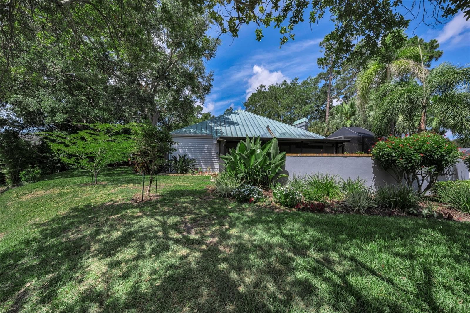 Looking from the pond, back to your new home! - 10497 LONGWOOD DR, SEMINOLE