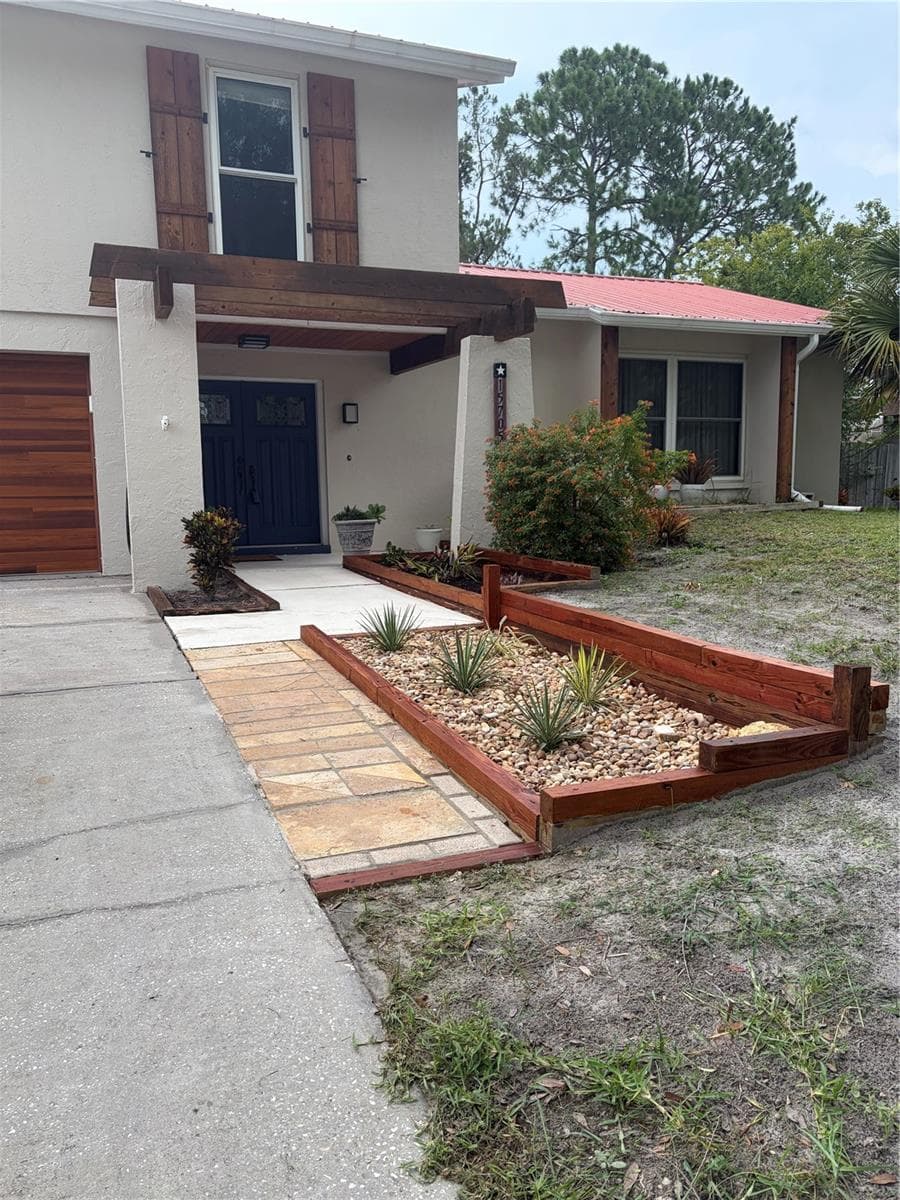 Recently stained planter to match house's rustic aesthetic - 15705 CASHMERE LN, TAMPA