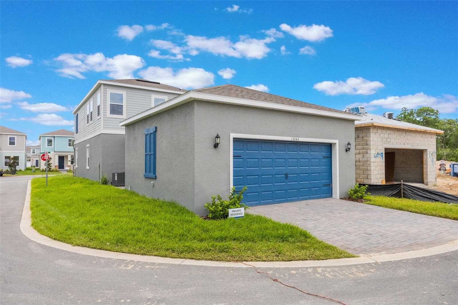 Corner lot detached garage in rear next door home is complete - 13043 SERENE GLADE RD, WINTER GARDEN