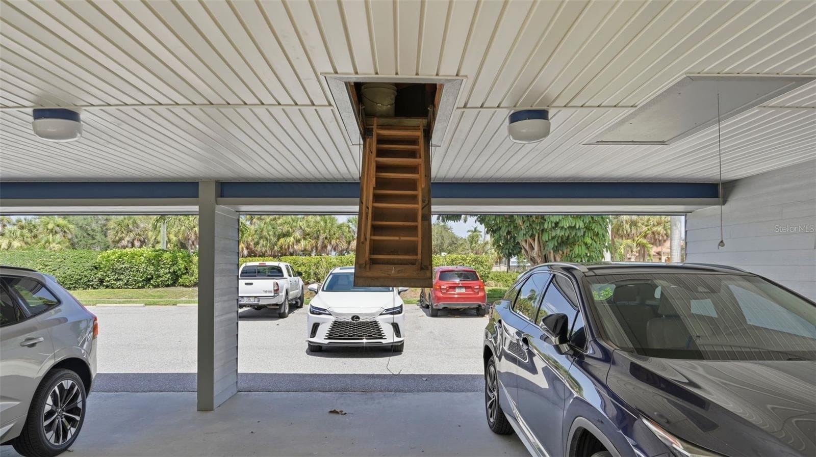 Car port and entry to storage above - 910 PINELLAS BAYWAY S #201, TIERRA VERDE