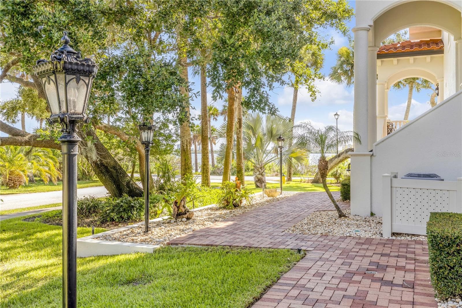 North side of building at front door - water views. - 5090 RIVERSIDE DR #105, PORT ORANGE