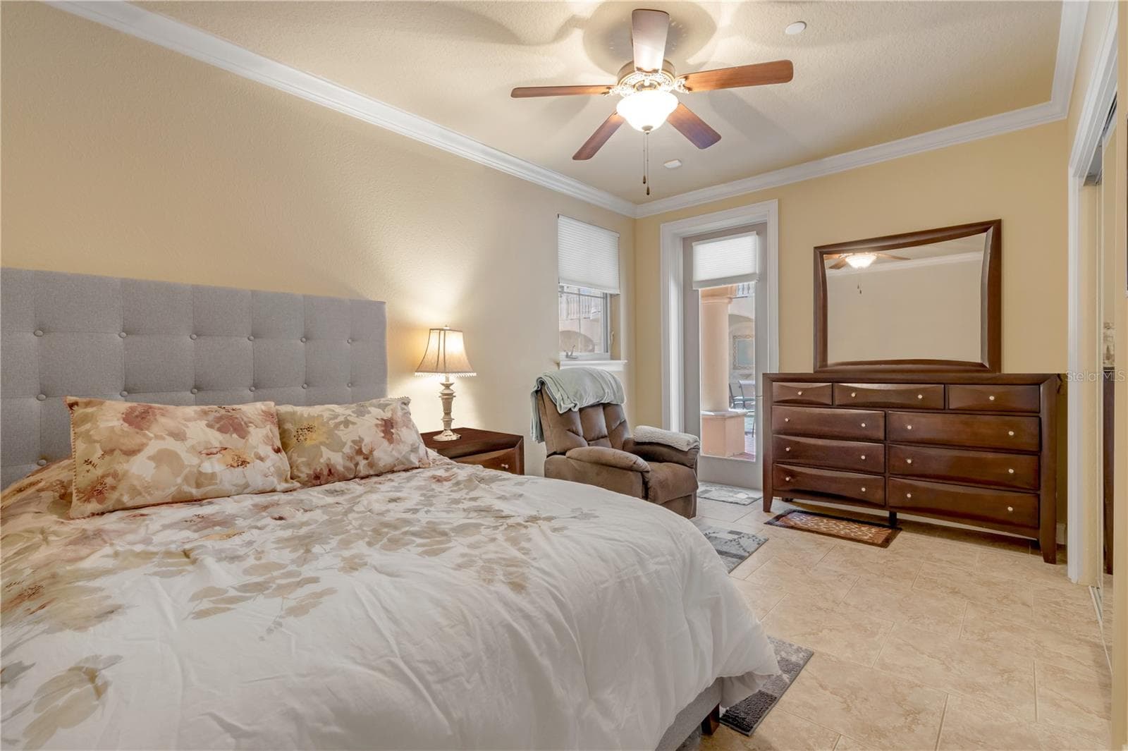 Guest Bedroom with exterior door to pool area - 5090 RIVERSIDE DR #105, PORT ORANGE