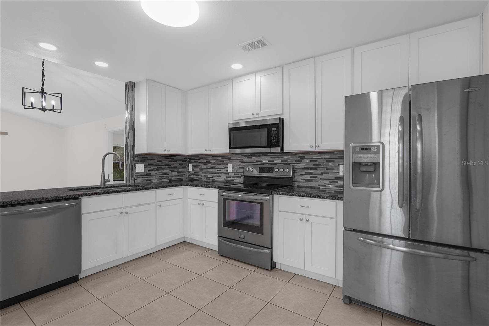 Beautifully updated kitchen with stainless steel appliances. - 1455 ELDRA DR, KISSIMMEE